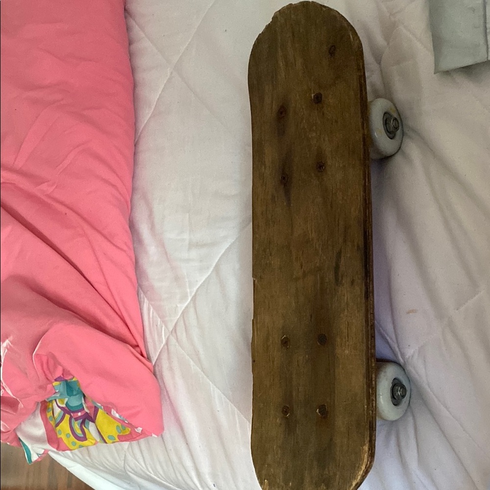 Vintage Wooden Skateboard with White Wheels
